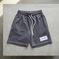 MAY20 shorts in charcoal, front view
