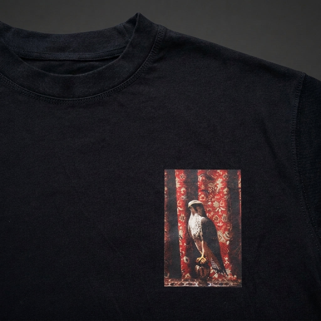 The Falconer tee in black, chest print detail